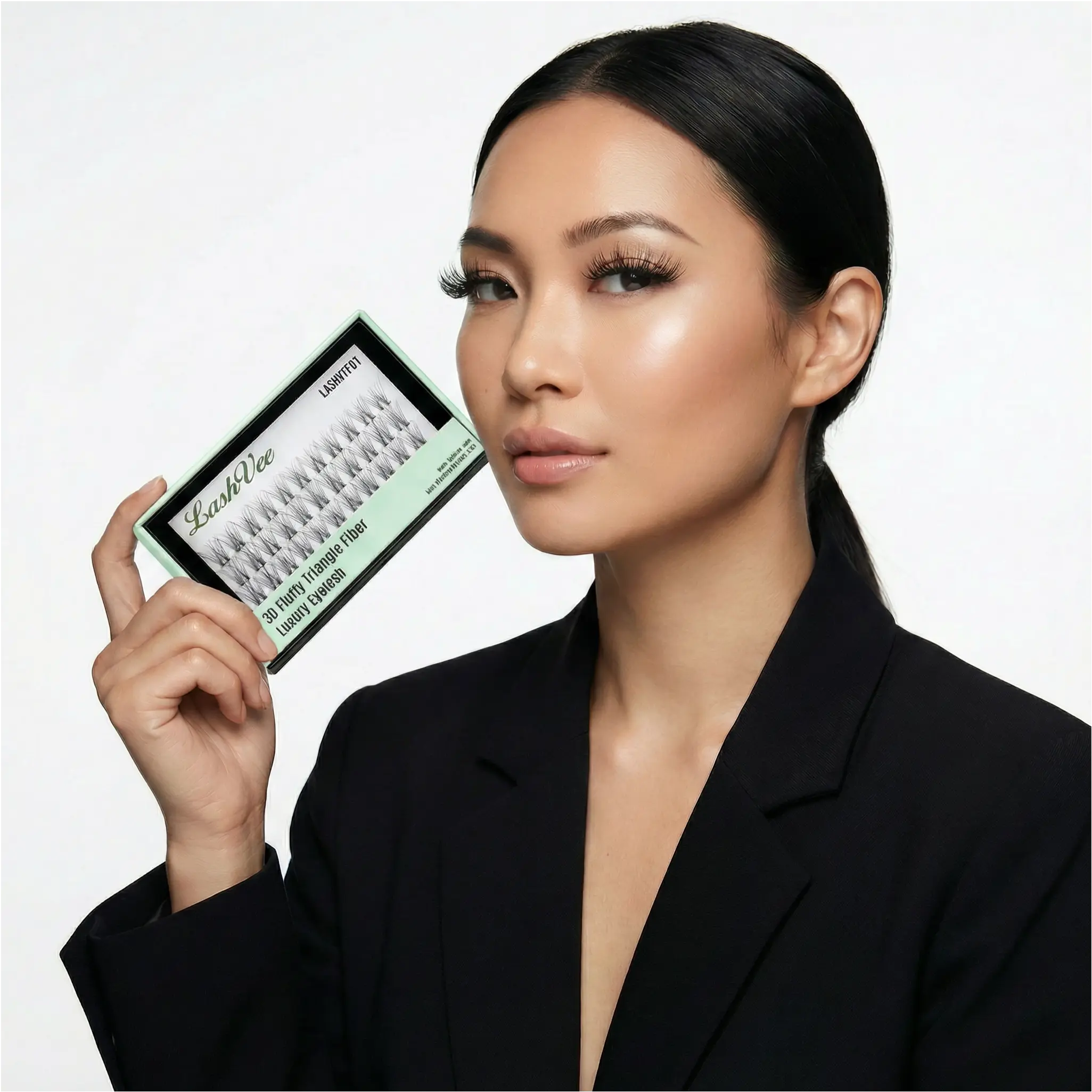 Elegant model holding luxury lash packaging — LashVee private label brand campaign