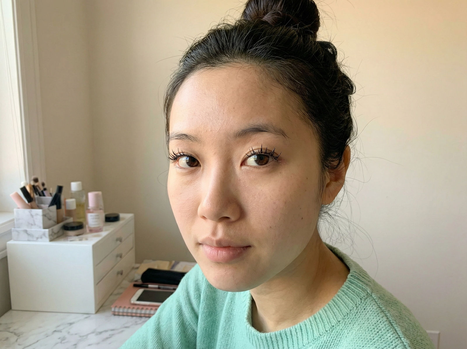 Close up of glossy wet-look DIY cluster lashes